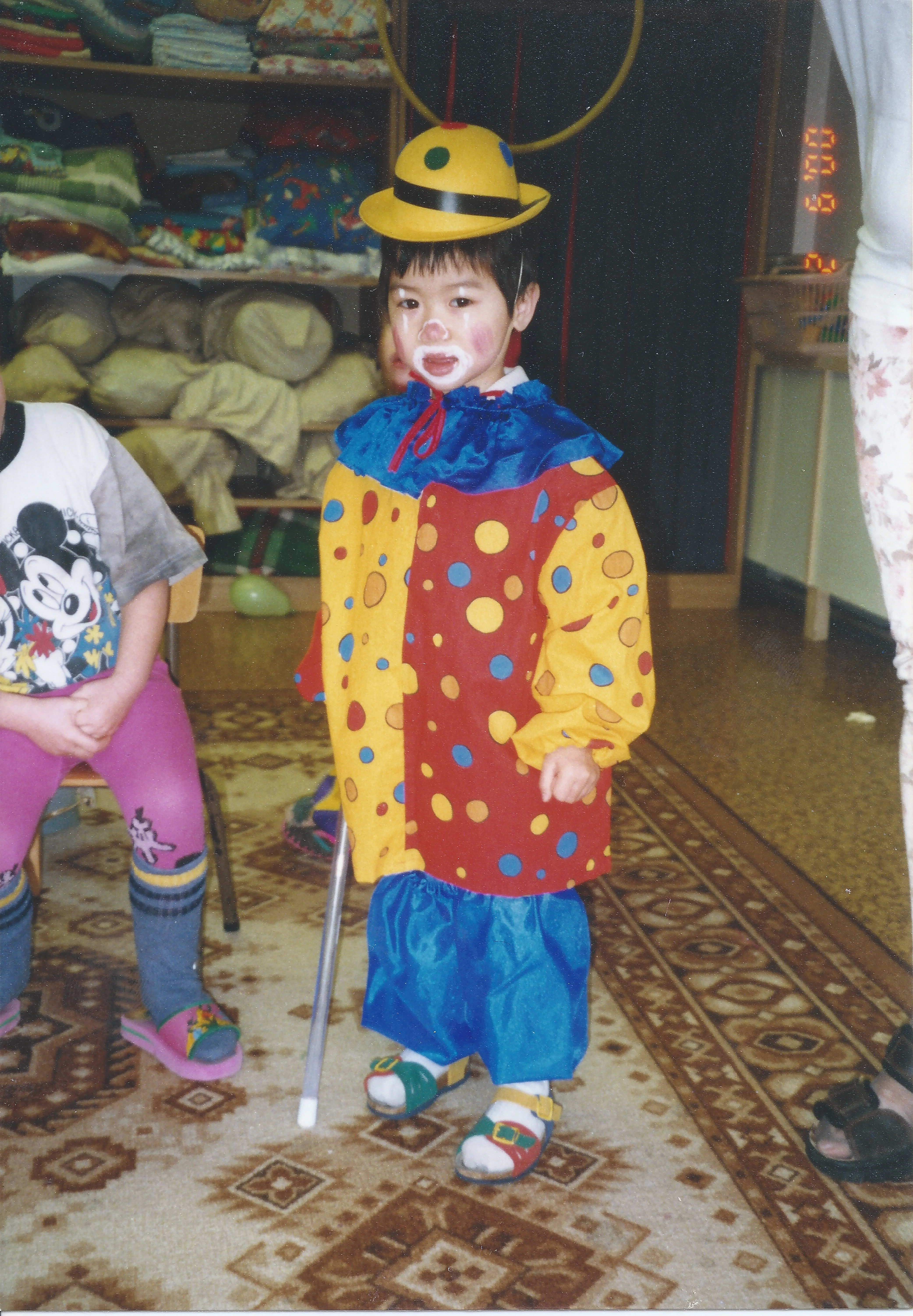 Jenny dressed as a clown as a child